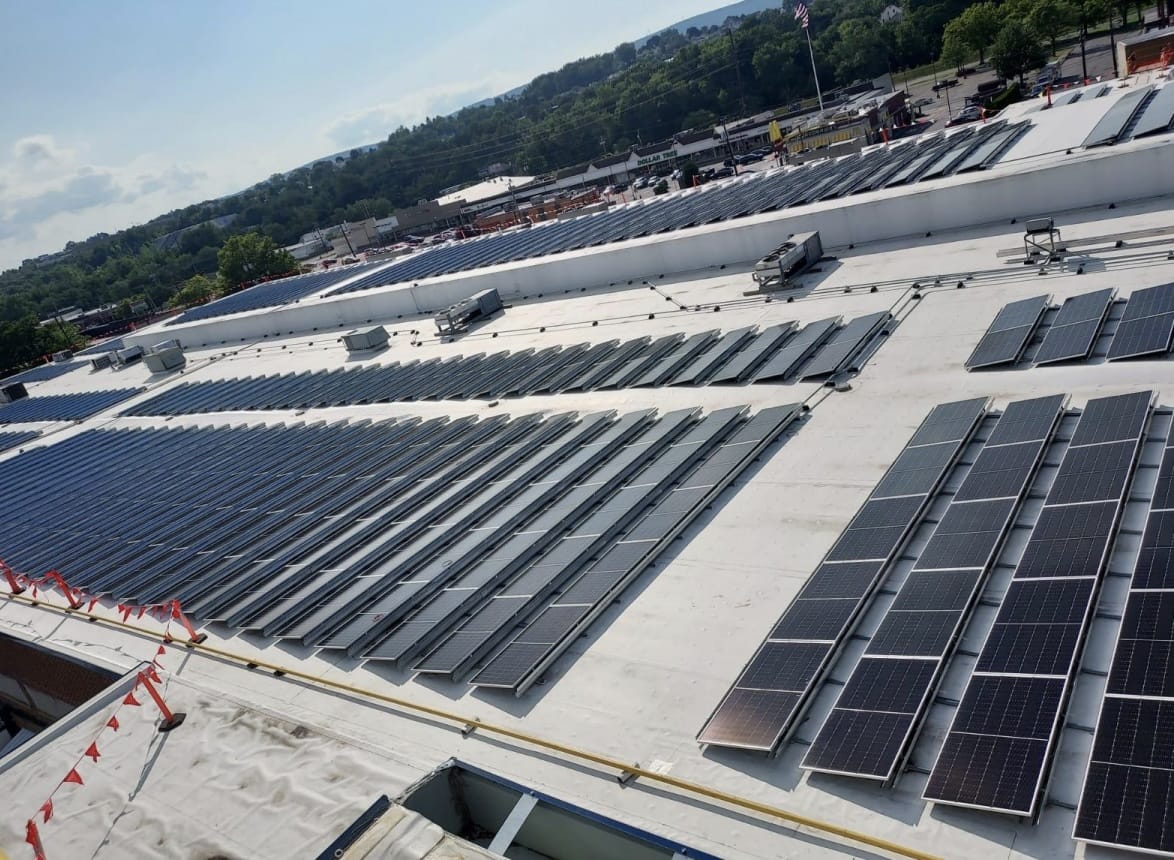 Extensive rooftop solar panel installation for commercial energy efficiency, guided by professional solar energy consultants